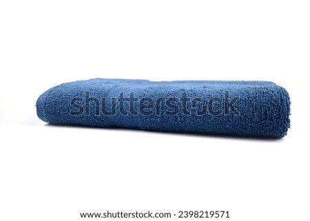 Blue Bath Towel with Stylish Side View Folded with Bold Arrow Design Crafted from 100 Cotton Terry for Ultimate Comfort Isolated with White Background Royalty-Free Stock Photo #2398219571