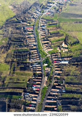 A small village in Eastern Europe seen from above. Aerial view with a rural area in Transylvania - Romania