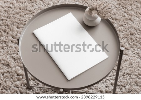 Magazine mockup with a pampas on the beige table. Royalty-Free Stock Photo #2398229115