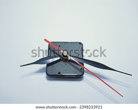 photo of a wall clock with the clock hands pointing downwards