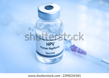 HPV vaccine in a vial, immunization and treatment of infection, scientific experiment Royalty-Free Stock Photo #2398234181