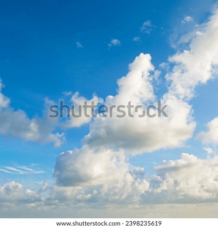 Light cumulus clouds on a blue sky.