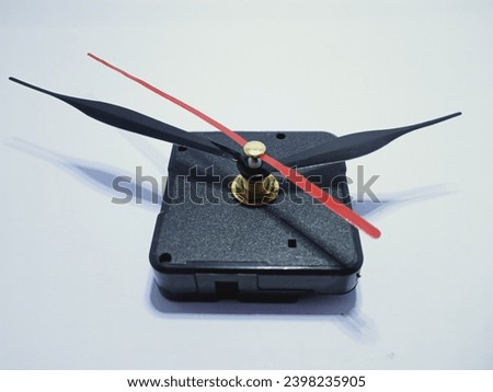 photo of a black wall clock seen from above 