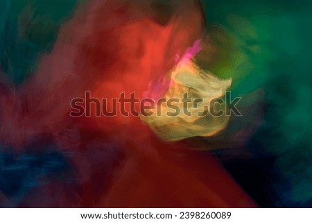Abstract photography, blurred spots of color, green, red, blue, creating an unusual texture with many meanings, created using intentional camera movements