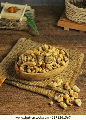 egg peanut snack in a wooden bowl Royalty-Free Stock Photo #2398261567