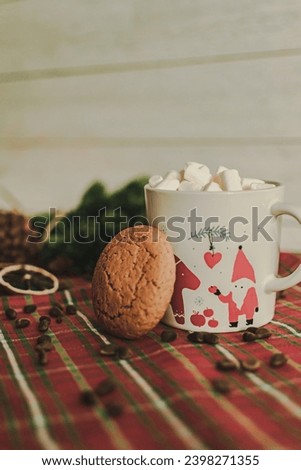 a mug with a Christmas pattern full of marshmallows. a Christmas card. cookies and slices of lemon and orange. festive drawing 