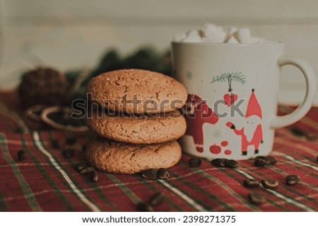 a mug with a Christmas pattern full of marshmallows. a Christmas card. cookies and slices of lemon and orange. festive drawing 