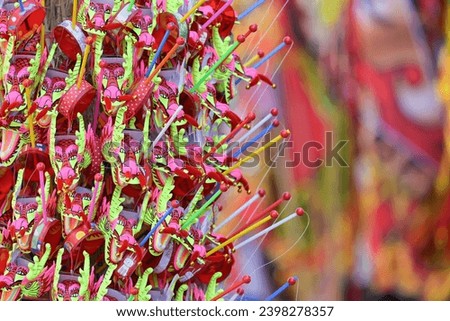Colorful Chinese dragon toys in Chinese New Year festival.Chinese New Year Decoration, Dragon toy paper on festive background.