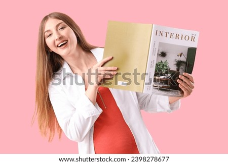 Beautiful young happy pregnant woman with magazine on pink background