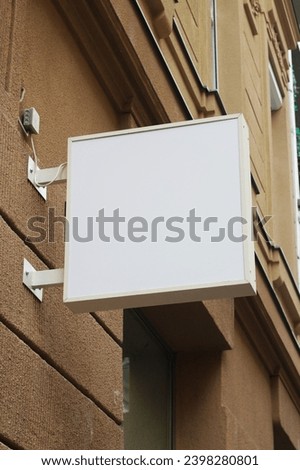 Outdoor hanging mounted sign on the wall mockup template. Signboard mock up for logo presentation.