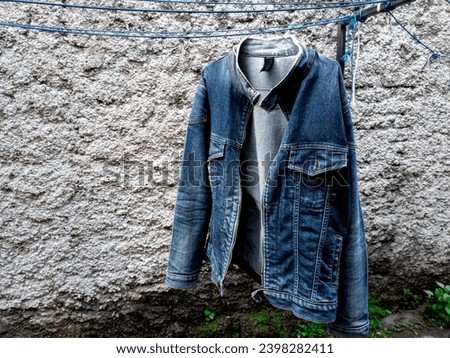 jacket that is being dried in the sun in the morning