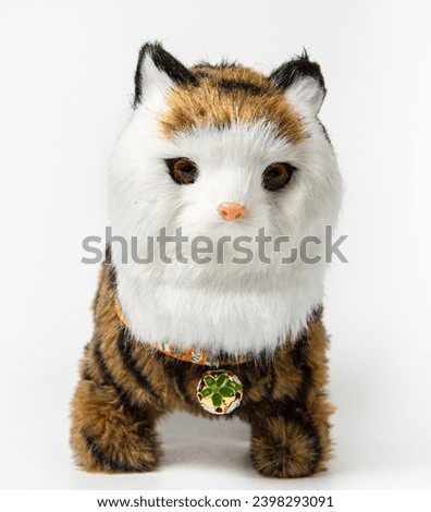 Children's toy cat on a white background