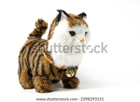 Children's toy cat on a white background