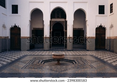 A symmetrical Riad (a traditional Moroccan courtyard) with beautiful patterns at the Dar Si Said Museum in Marrakesh, Morocco Royalty-Free Stock Photo #2398300183