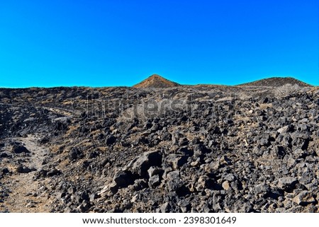 Tenerife, Canary Islands, Spain. November 10, 2023. Volcanic, rocky south Tenerife island ocean shores. Trail from Golf Del Sur to the Natural Monument Montana Amarilla.