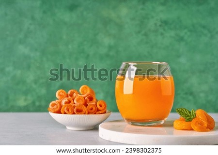 Middle Eastern  apricot  drink 
 Qamar Al-Din. Rolled dried apricot paste and dried apricot  . Traditional ramadan food                              Royalty-Free Stock Photo #2398302375