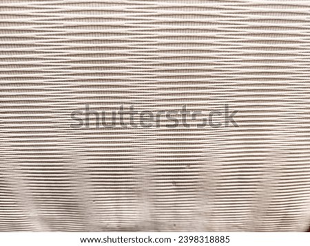 Paper wallpaper with a scratch pattern and line. Abstract background, pastel cream colored vintage carpet, soft wrinkled pattern. Texture, frame, copy space