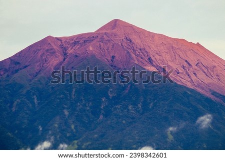 Mount Kerinci (Gunung Kerinci) is the highest mountain in Sumatra, the highest volcano and the highest peak in Indonesia with an altitude of 3805 masl, located in the Kerinci Seblat National Park area Royalty-Free Stock Photo #2398342601