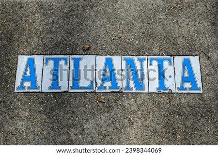 Atlanta tile inlay street sign on the sidewalk in Uptown neighborhood of New Orleans, Louisiana, USA