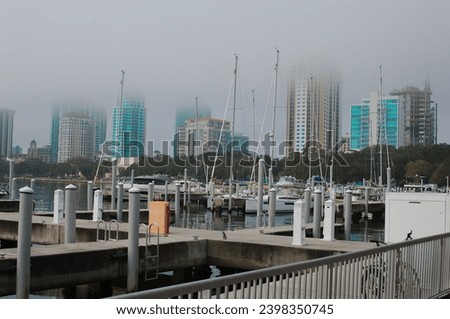 Vinoy Basin Saint Petersburg Florida with boats, docks and city skyline with low fog early morning. 