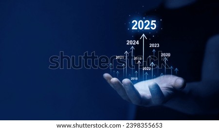 Businessman draws increase arrow graph corporate future growth year 2024 to 2025. Planning,opportunity, challenge and business strategy. New Goals, Plans and Visions for Next Year 2025. Royalty-Free Stock Photo #2398355653