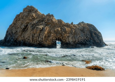 Keyhole Arch at Pfeiffer Beach California landscape in sunny summer day, Big Sur, California. Royalty-Free Stock Photo #2398419191