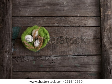 painted easter eggs on dark wooden background