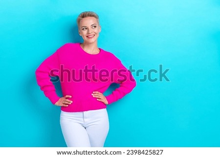 Photo of good mood gorgeous woman with short hair dressed pink jumper look at proposition empty space isolated on teal color background