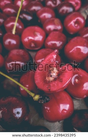 Wormy ripe red cherries close-up. Bad harvest concept. The problem of food waste Royalty-Free Stock Photo #2398435395