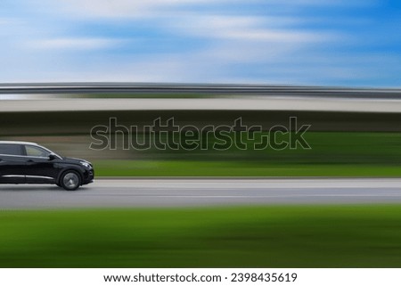 Car on speed blurred background. Driving car with free space for text, copy space. Car concept, car themed picture.