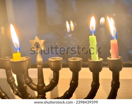 Hanukkah Candles with window in the background