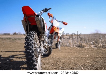 Dirt Bike Rear Tire in Focus with Second Dirt Bike in Background