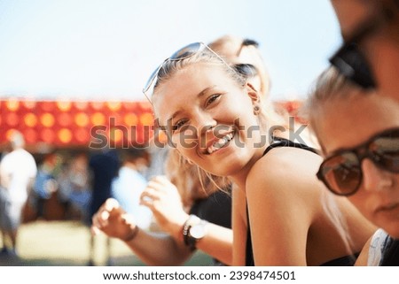 Outdoor, portrait or happy woman in music festival on holiday vacation to relax on New Year. Carnival, crowd or people with freedom, smile or youth culture for concert or fun party celebration event