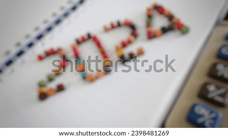Blurry photo of the unique number 2024 as a symbol of the new year 2024 from an arrangement of colored wooden beads. Theme concept for welcoming the new year 2024.