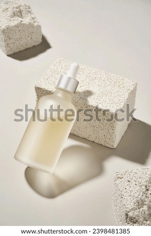 Simple skin care product on stone essence skin care scrub translucent Royalty-Free Stock Photo #2398481385
