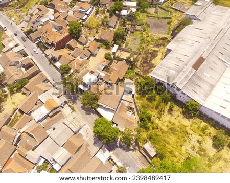 Industrial Photography. Aerial Landscapes. Top view of Food processing factory district in the Pendeuy area, located on the edge of the city of Bandung - Indonesia. Aerial Shot from a flying drone.