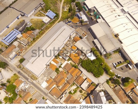 Industrial Photography. Aerial Landscapes. Top view of Food processing factory district in the Pendeuy area, located on the edge of the city of Bandung - Indonesia. Aerial Shot from a flying drone.