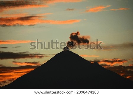 Volcán Popocatépetl ejecting ash in a scenic sunset Royalty-Free Stock Photo #2398494183
