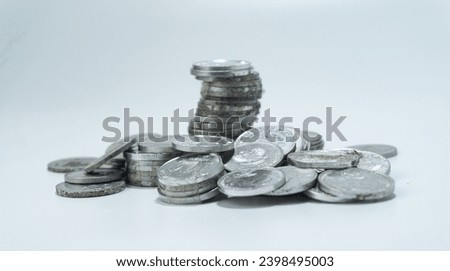 Stack of Indonesian Rupiah currency coins on a white background
