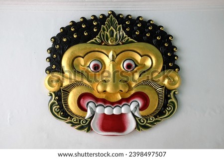 A relief image of Batara Kala's head, which means the symbol of the god of the world and time, is attached to the wall of the Javanese King's residence at the Yogyakarta Palace, Indonesia