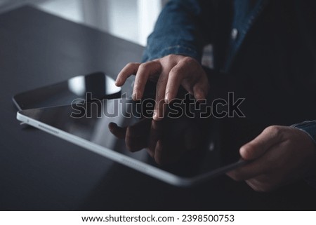 Close up of woman hand using digital tablet, finger touching on screen, reading E-book via E-reader mobile app at office, digital education, online working, freelance at work