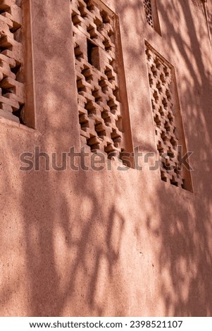 An abstract image of elements in a historic village in the heart of Iran. Walls, windows, and roofs are a combination of curves and concepts. A multiplicity of beliefs alongside simplicity 