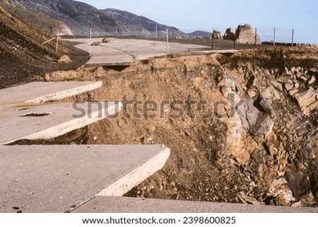 Archival 1983 view of collapsed storm damaged section of Pacific Coast Highway north of Malibu at Point Mugu in Ventura County, California.   Shot on film. Royalty-Free Stock Photo #2398600825