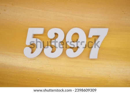 The golden yellow painted wood panel for the background, number 5397, is made from white painted wood.