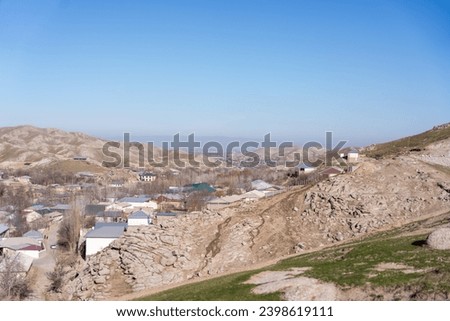 Autumn season Mountain View of a small settlement in downhill, Uzbekistan mountains, beautifully landscaped, high quality pictures.