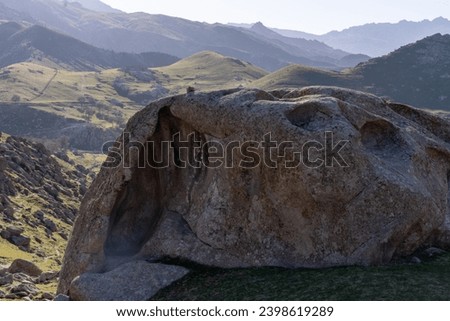 natural concave formation in a rock on the top of the mountain, Uzbekistan mountains, beautifully landscaped, high quality pictures.