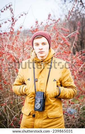 Portrait of a man wearing camera, outdoor