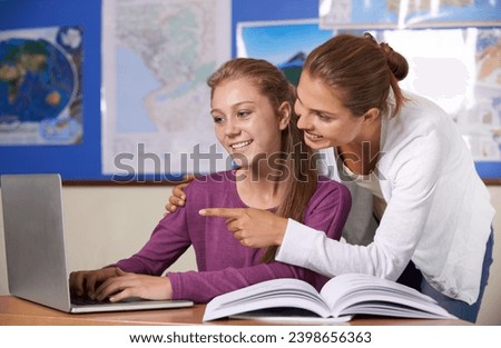 Teacher, student and laptop in classroom for education, learning and research with geography or scholarship books. Happy girl and woman typing on computer at high school for online map guide or help Royalty-Free Stock Photo #2398656363