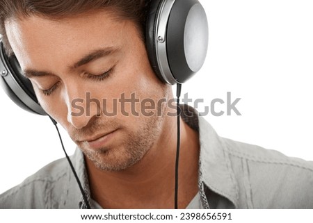 Calm, man and listening to music in studio with headphones for audio subscription, streaming multimedia or radio on white background. Face, model and hearing peaceful podcast, sound or song at mockup