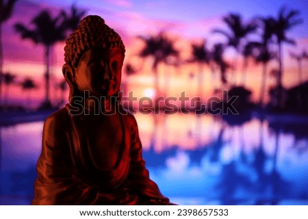 Buddha Purnima and Vesak day concept, Buddha statue with low key light against beautiful and colorful background close up. Meditation Royalty-Free Stock Photo #2398657533
